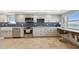 Modern kitchen with white cabinets and ocean view at 5000 Gulf Blvd # 704, St Pete Beach, FL 33706