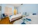 Blue bedroom with twin beds and blue floral bedding at 7787 39Th N Ter # 7787, St Petersburg, FL 33709