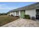 Exterior view of a house with green door and well-maintained lawn at 7787 39Th N Ter # 7787, St Petersburg, FL 33709