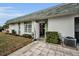 Landscaped exterior of a home with a green front door at 7787 39Th N Ter # 7787, St Petersburg, FL 33709