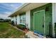 Close-up view of the home's front entrance and landscaping at 7787 39Th N Ter # 7787, St Petersburg, FL 33709