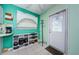 Bright kitchen with white cabinets and teal walls at 7787 39Th N Ter # 7787, St Petersburg, FL 33709