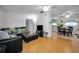 Light-filled living room with a comfy sectional sofa and wood floors at 7787 39Th N Ter # 7787, St Petersburg, FL 33709