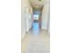 Bright hallway with tile flooring and access to other rooms at 10188 Cross Timber Ter, Land O Lakes, FL 34638