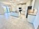 Modern kitchen featuring white cabinets, granite countertops, and stainless steel appliances at 10188 Cross Timber Ter, Land O Lakes, FL 34638