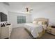 Bright bedroom with king-size bed and large window at 16135 Weathered Windmill Ter, Odessa, FL 33556