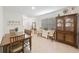 Dining area with table, chairs, and china cabinet at 16135 Weathered Windmill Ter, Odessa, FL 33556