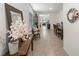 Bright entryway with tile floors, leads to living and dining areas at 16135 Weathered Windmill Ter, Odessa, FL 33556