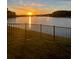 Scenic sunset over lake with fountain, view from backyard at 16135 Weathered Windmill Ter, Odessa, FL 33556