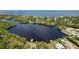 Aerial view of waterfront community with lush landscaping at 2325 Pleasant Hill Ln, Holiday, FL 34691