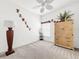 Bedroom with ceiling fan and built-in shelving at 2325 Pleasant Hill Ln, Holiday, FL 34691