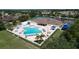 Resort-style community pool with ample lounge chairs and surrounding amenities at 2325 Pleasant Hill Ln, Holiday, FL 34691