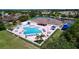 Resort-style community pool with ample lounge chairs and surrounding amenities at 2325 Pleasant Hill Ln, Holiday, FL 34691