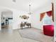 Elegant dining room featuring a chandelier and neutral carpeting at 2325 Pleasant Hill Ln, Holiday, FL 34691