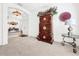 Charming sitting room with decorative cabinet and window seating at 2325 Pleasant Hill Ln, Holiday, FL 34691