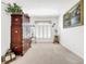 Light-filled sitting room featuring a large window and a wooden cabinet at 2325 Pleasant Hill Ln, Holiday, FL 34691