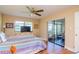 Bedroom with sliding doors to balcony at 2400 Winding Creek Blvd # 25-101, Clearwater, FL 33761