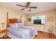 Spacious bedroom with a comfortable bed and plenty of natural light at 2400 Winding Creek Blvd # 25-101, Clearwater, FL 33761