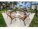 Outdoor grilling area with seating and picnic tables at 2400 Winding Creek Blvd # 25-101, Clearwater, FL 33761