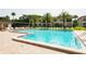 Community pool with plenty of lounge chairs at 2400 Winding Creek Blvd # 25-101, Clearwater, FL 33761