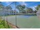 Tennis court with chain link fence at 2400 Winding Creek Blvd # 25-101, Clearwater, FL 33761