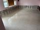 An unfinished living space featuring bare walls ready for renovation with a polished concrete floor and natural lighting at 999 38Th Ne Ave, St Petersburg, FL 33704