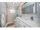 Elegant bathroom with a walk-in shower, double sinks, and modern finishes at 4751 Baywood Point S Dr, Gulfport, FL 33711