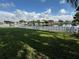 Spacious backyard with a white picket fence and water view at 143 92Nd Ne Ave, St Petersburg, FL 33702