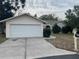 Ranch-style home with attached garage and driveway at 10608 Bucks Run, New Port Richey, FL 34654