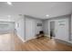 Light and airy entryway with wood floors and bench at 1995 Arvis E Cir, Clearwater, FL 33764