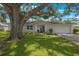 Newly renovated home with a large oak tree and spacious yard at 1995 Arvis E Cir, Clearwater, FL 33764