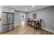 Modern kitchen with white shaker cabinets, quartz countertops, and stainless steel appliances at 1995 Arvis E Cir, Clearwater, FL 33764