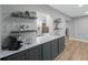 Stylish kitchen with a coffee bar and dark gray cabinets at 1995 Arvis E Cir, Clearwater, FL 33764