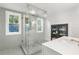 Modern bathroom with a glass-enclosed shower, decorative tile work, and stylish fixtures at 4132 4Th S St, St Petersburg, FL 33705