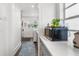 Bright kitchen area with stainless microwave, open counter space and tile flooring at 4132 4Th S St, St Petersburg, FL 33705