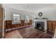 Cozy living room with a fireplace, windows, and hardwood floors under construction at 4132 4Th S St, St Petersburg, FL 33705