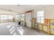 Sun-filled room featuring large windows, neutral walls, and stylish herringbone tile flooring at 4132 4Th S St, St Petersburg, FL 33705