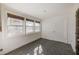 Bright sun room with herringbone floors, multiple windows, and shiplap walls at 4132 4Th S St, St Petersburg, FL 33705