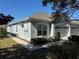 Light gray exterior with a walkway and green landscaping at 6926 Surrey Oak Dr, Apollo Beach, FL 33572