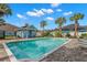 Community pool with lounge chairs and a pool house at 6926 Surrey Oak Dr, Apollo Beach, FL 33572