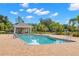 Community pool with a pool house and lounge chairs at 6926 Surrey Oak Dr, Apollo Beach, FL 33572