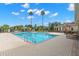 Community swimming pool with surrounding patio at 6926 Surrey Oak Dr, Apollo Beach, FL 33572