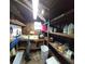 Partially finished basement with workshop shelving and workbench at 283 Pelican N Dr, Oldsmar, FL 34677