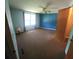 Spacious bedroom with ceiling fan and neutral carpeting at 283 Pelican N Dr, Oldsmar, FL 34677