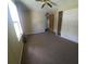 Bedroom with ceiling fan, closet, and neutral carpeting at 283 Pelican N Dr, Oldsmar, FL 34677
