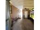 Enclosed patio with ceiling fan and room for seating at 283 Pelican N Dr, Oldsmar, FL 34677