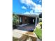 Mobile home with covered patio and brick pavers at 283 Pelican N Dr, Oldsmar, FL 34677