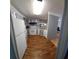 Efficient kitchen featuring gray cabinets and wood-look flooring at 283 Pelican N Dr, Oldsmar, FL 34677