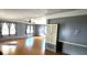 Living room with laminate floors, neutral walls, and built-in storage at 283 Pelican N Dr, Oldsmar, FL 34677