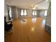Bright living room featuring laminate floors and ample natural light at 283 Pelican N Dr, Oldsmar, FL 34677